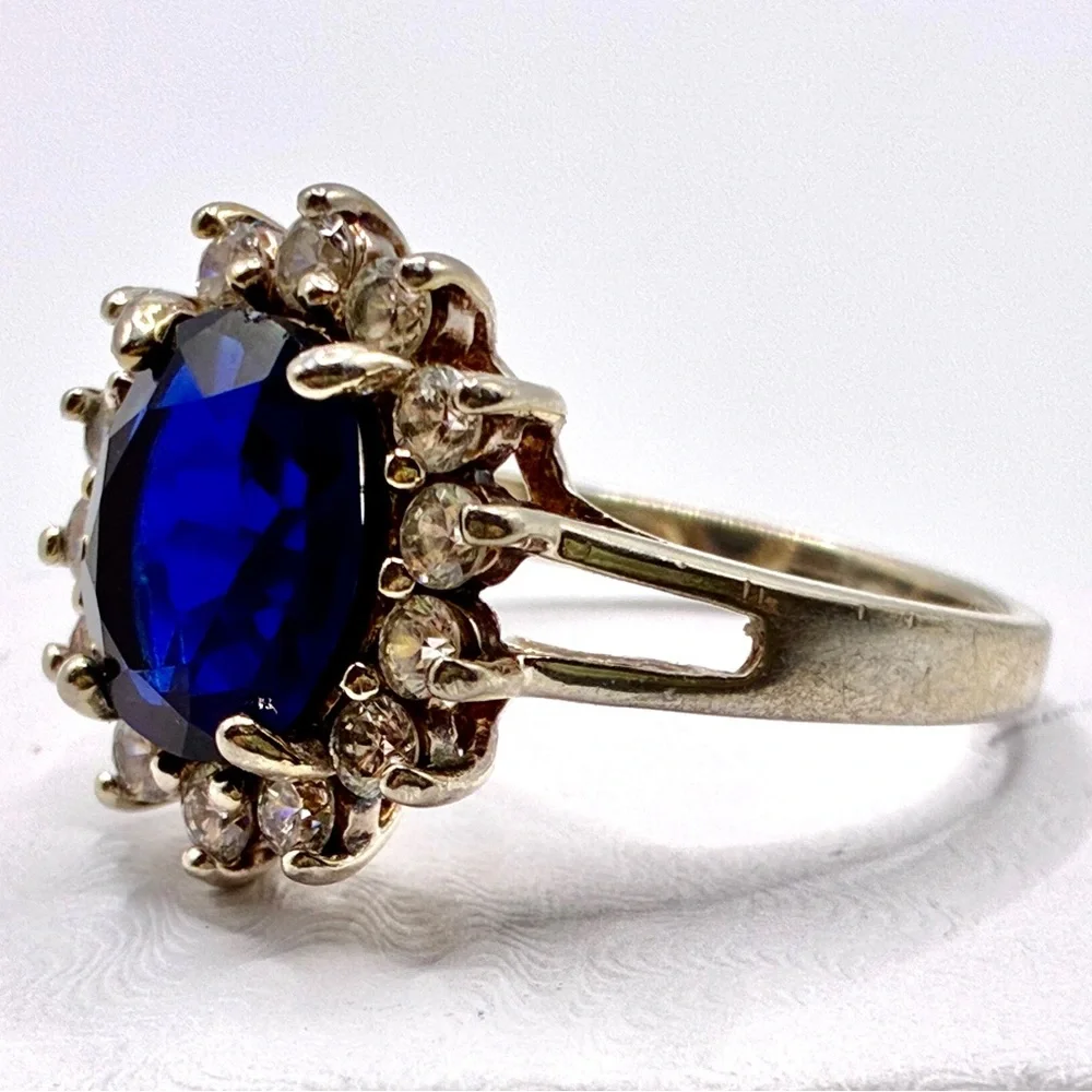 VTG Signed JC Oval Cut Cubic Zirconia Sapphire with Halo of CZ’s In Silver Tone